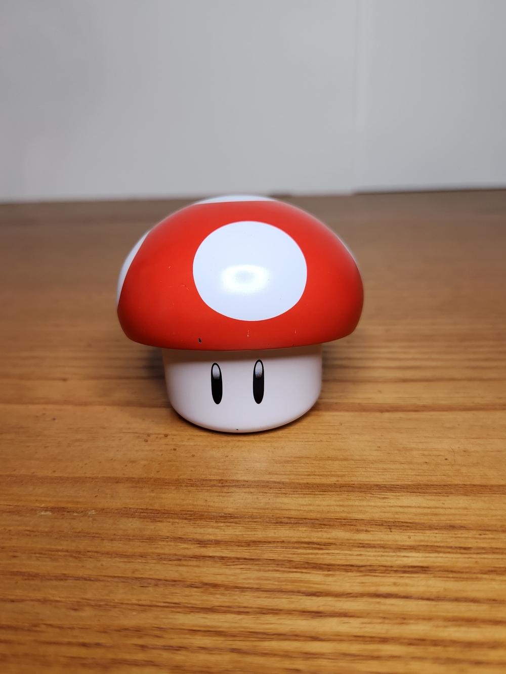 Super Mario Mushroom empty tin 2 1/2" H X 3" W.